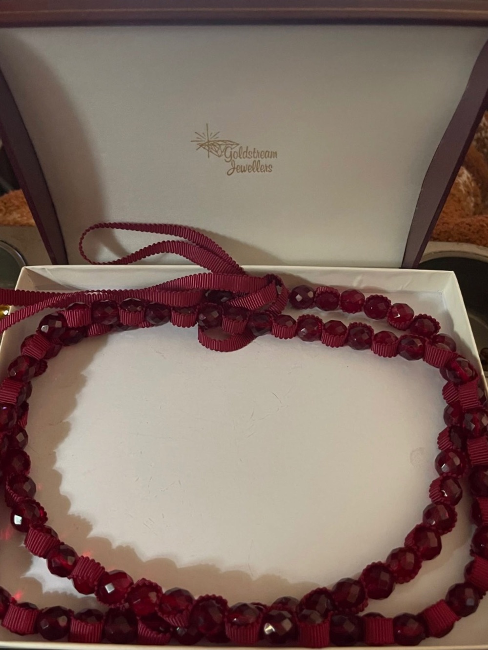 Elegant Vintage Red Faceted Glass Bead Necklace Featuring a Textured Ribbon